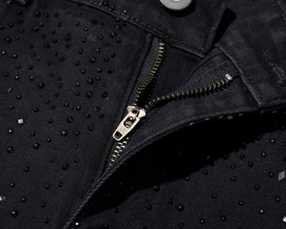 Slim-fit jeans i svart denim med strasspynt