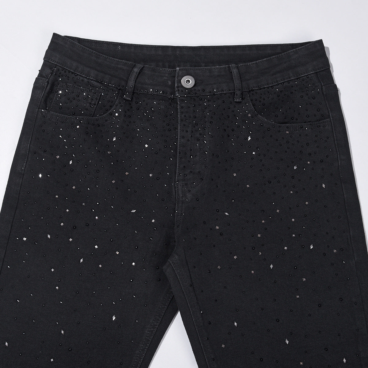 Slim-fit jeans i svart denim med strasspynt