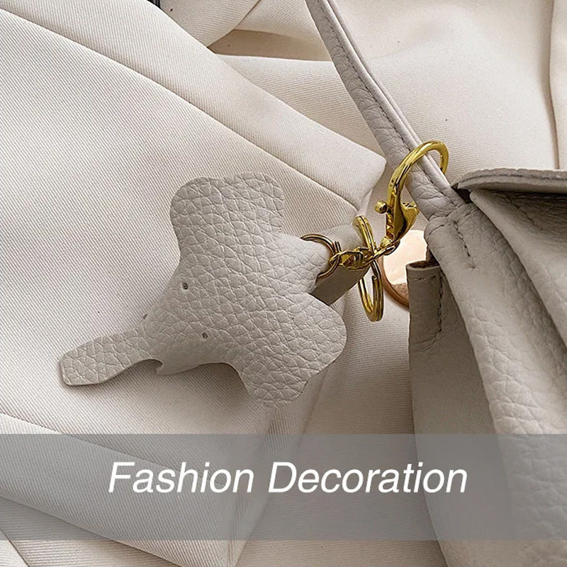 High end mote crossbody-veske for kvinner med elefantanheng