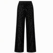 Breie bukser med glitterpaljetter for kvinner